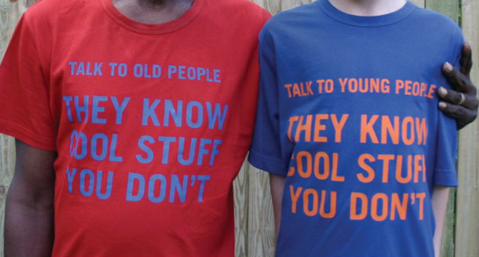 Red t-shirt with words, talk to old people, they know cool stuff, and blue t-shirt with words, talk to young people they know cool stuff